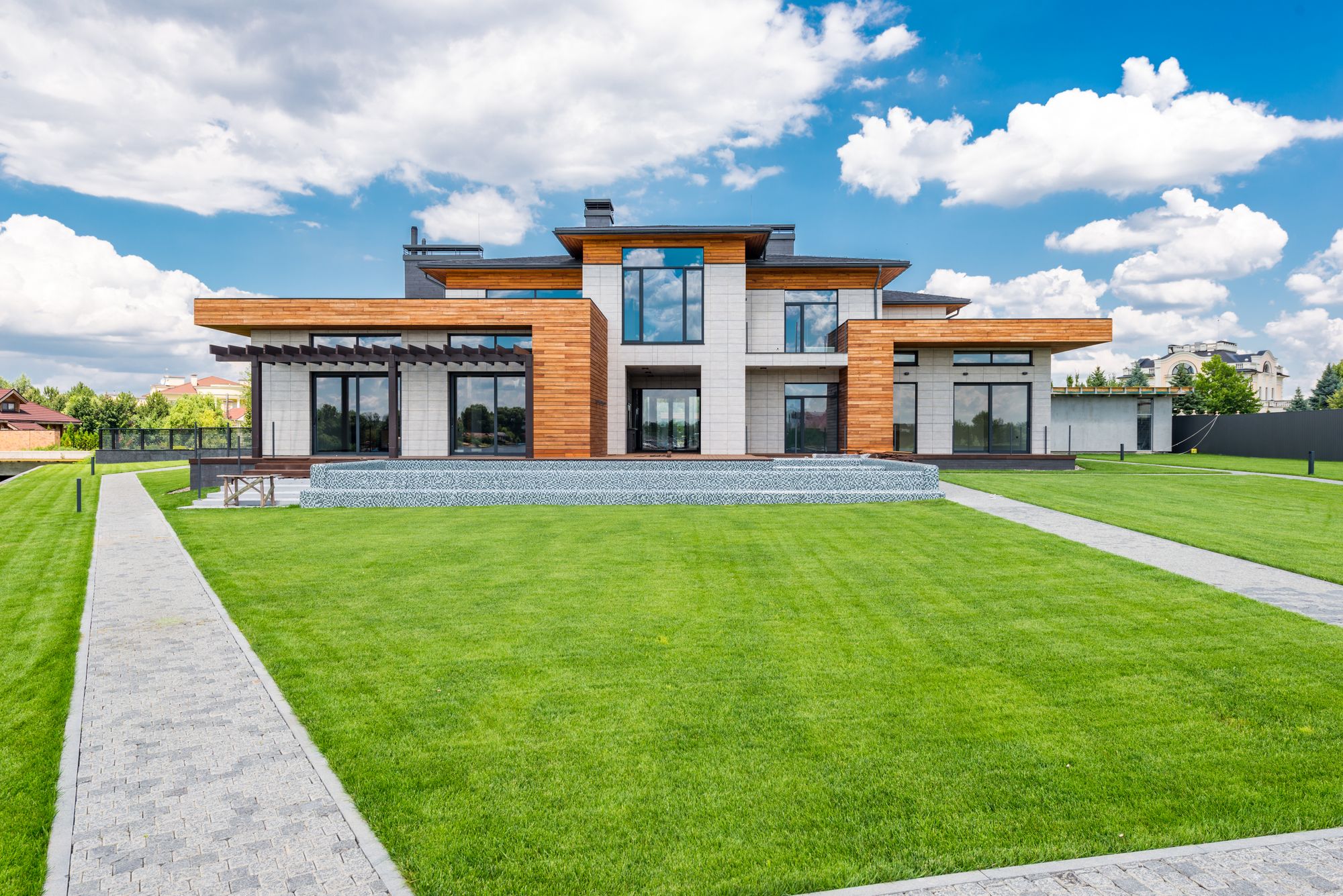Modern home with large glass doors opening onto a garden